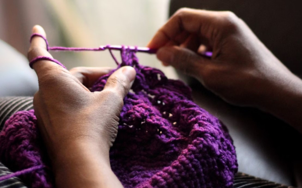 Crocheting purple thread by Imani on Unsplash