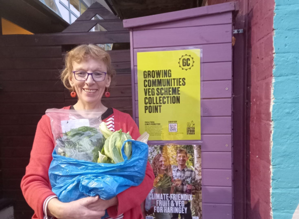 Mary, a GC member, collecting her organic veg bag from Hornsey Vale Community Centre