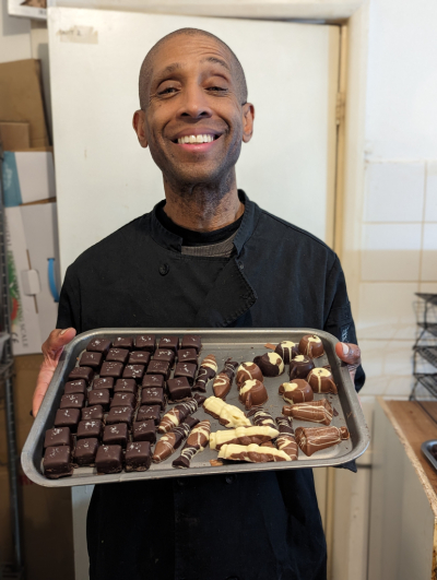 Anthony F holding tray of chocolates