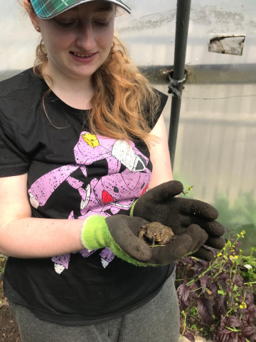 Amber trainee holding a toad
