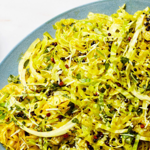 shredded cabbage with spices on blue plate