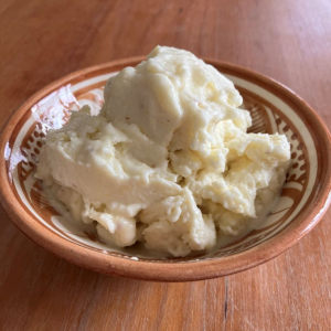vegn lemon ice-cream in bowl on wooden table