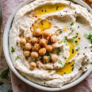 aubergine dip, white bowl, chick peas, olive oil