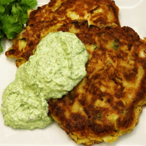Kohlrabi and carrot fritters with avocado sauce